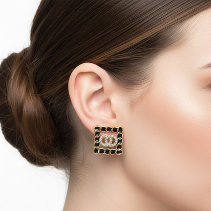 Elegant Gold-Plated Interlocking Circle Studs with Crystal Border.
