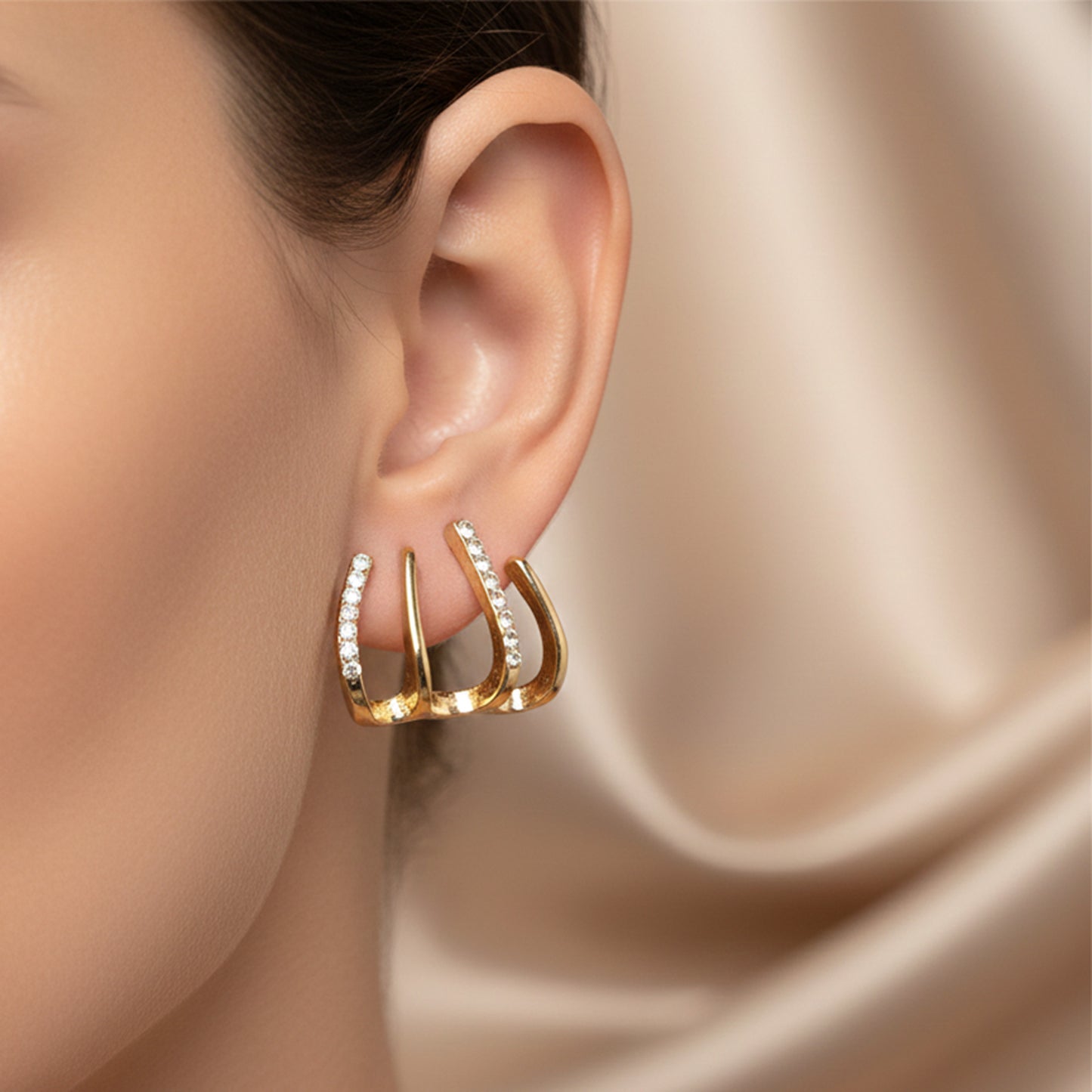 Gold-Plated Four-Prong Claw Earrings with Graduated Diamond-Cut Crystals